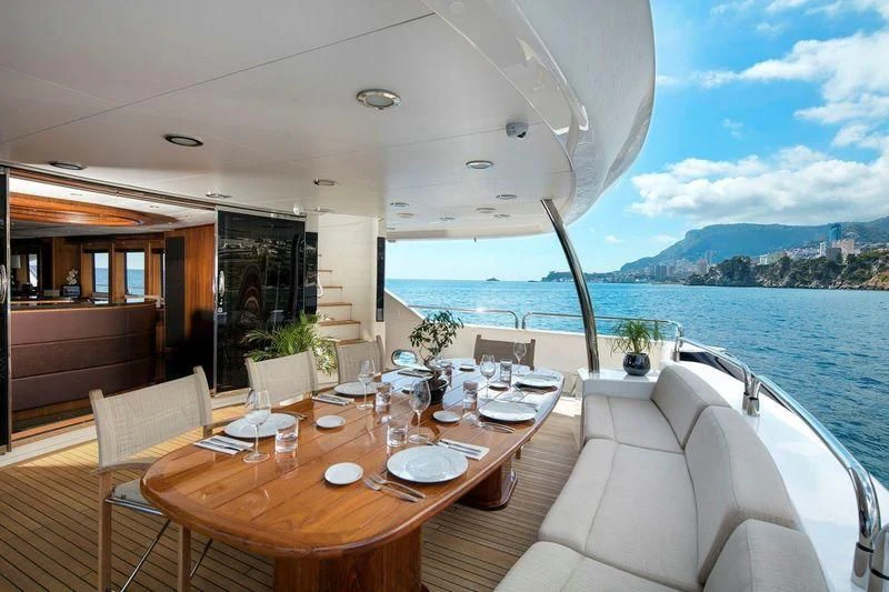 a table set for a meal on a boat aboard THE DEVOCEAN Yacht for Sale