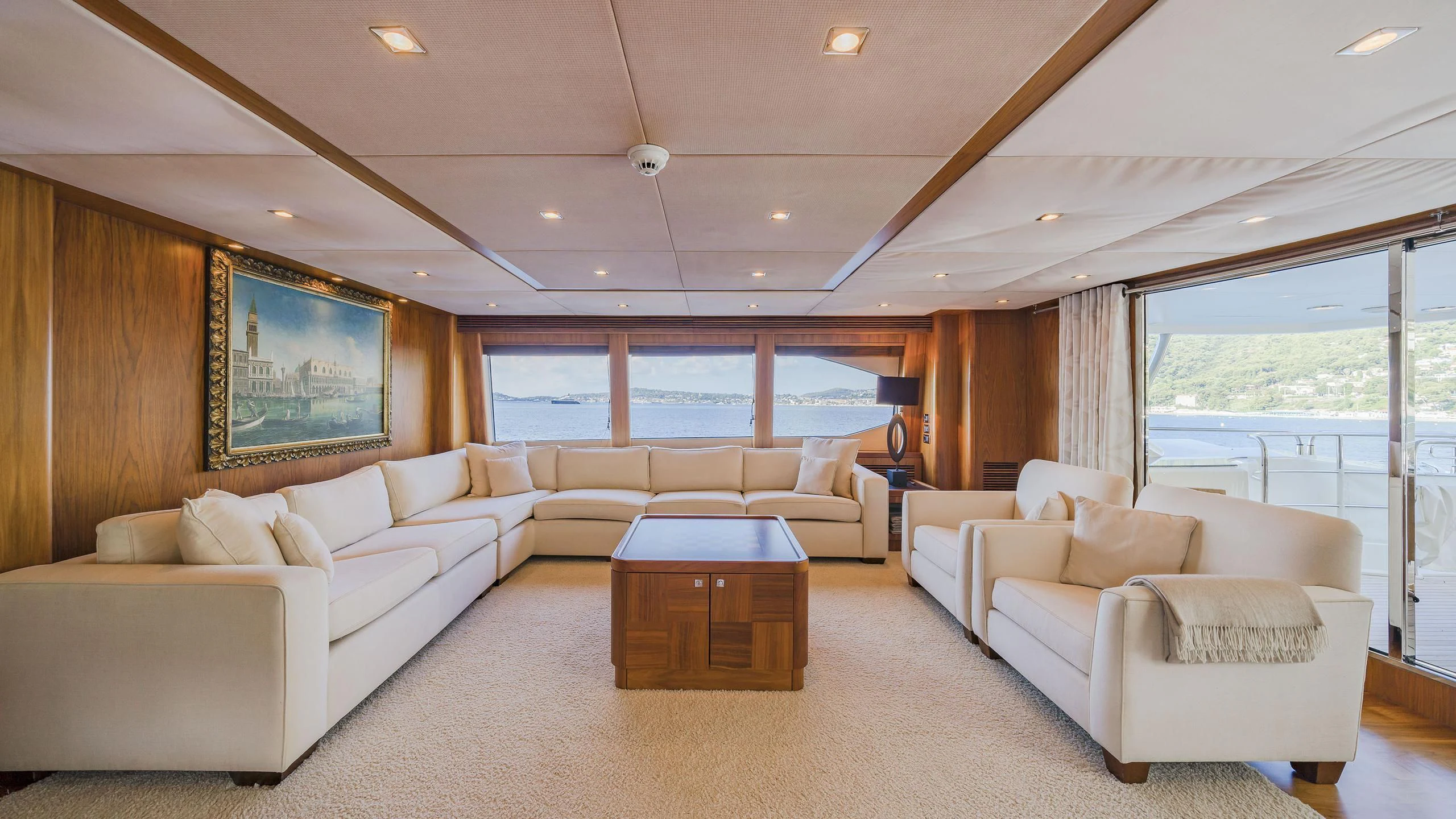 a living room with a large window aboard THE DEVOCEAN Yacht for Sale