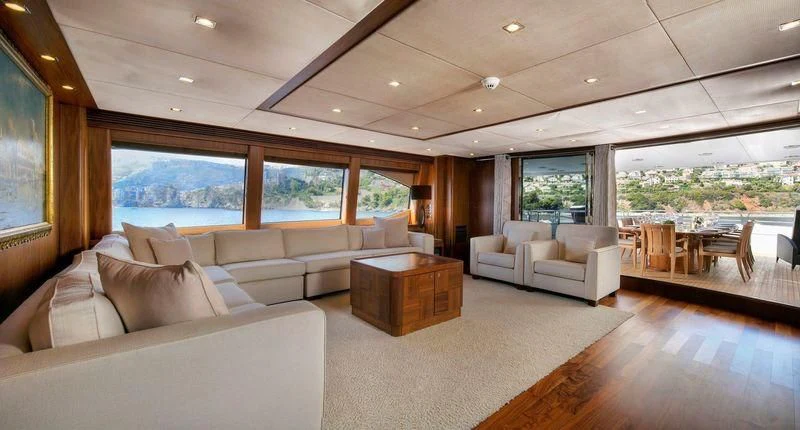 a living room with a large window aboard THE DEVOCEAN Yacht for Sale