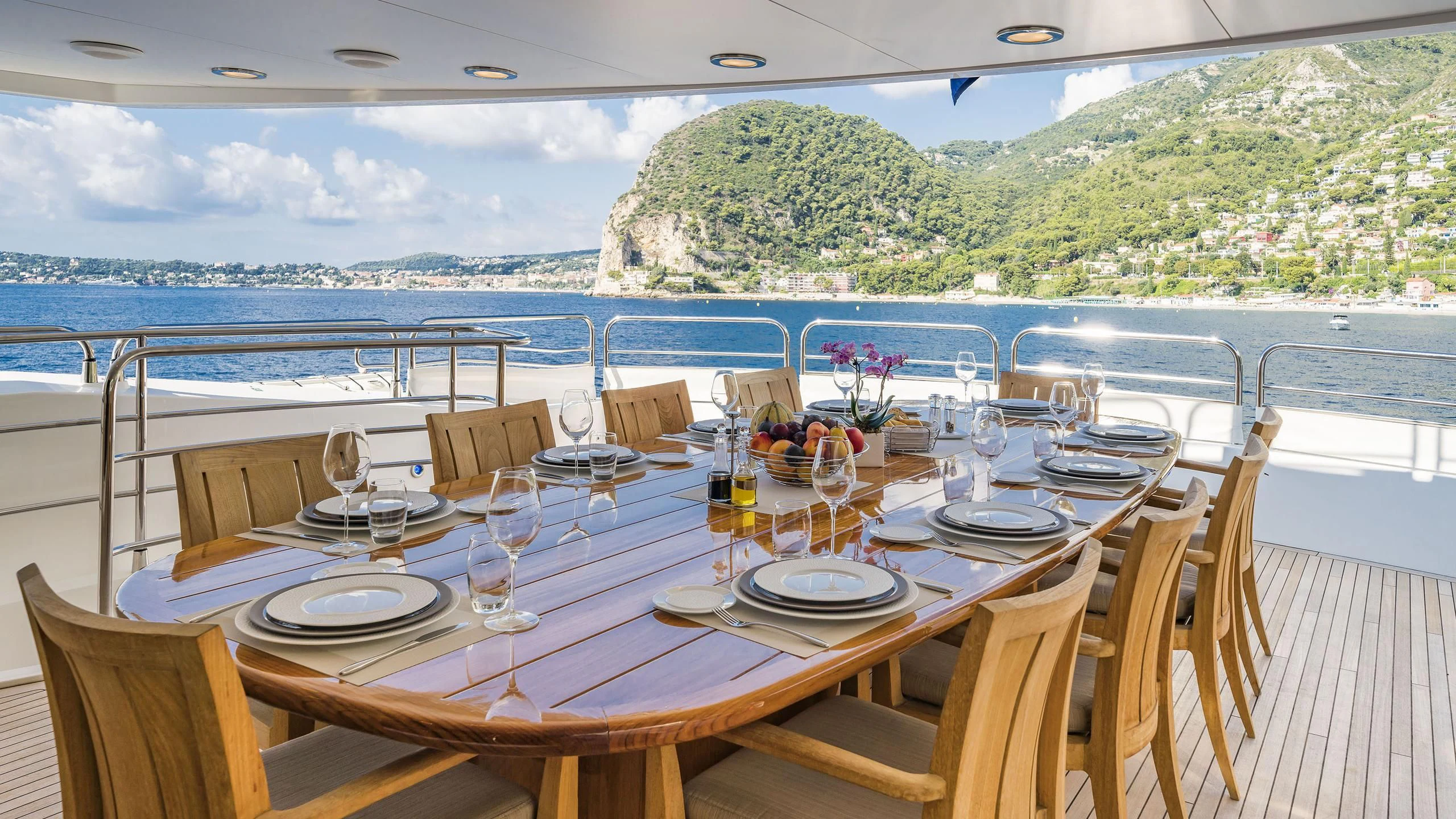 a table set for a dinner aboard THE DEVOCEAN Yacht for Sale