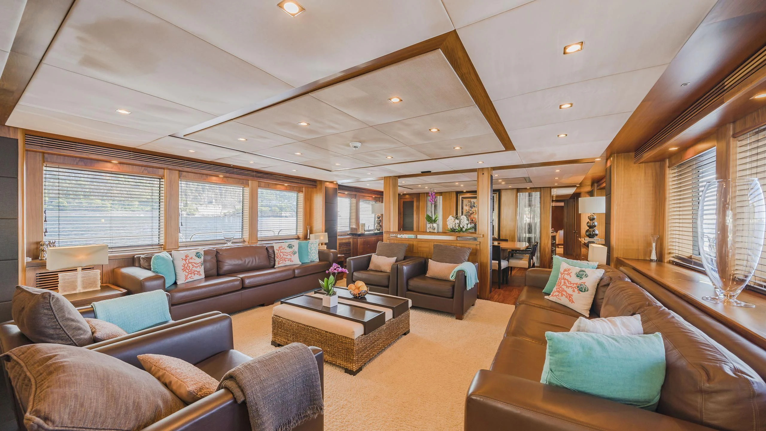 a living room with leather couches aboard THE DEVOCEAN Yacht for Sale