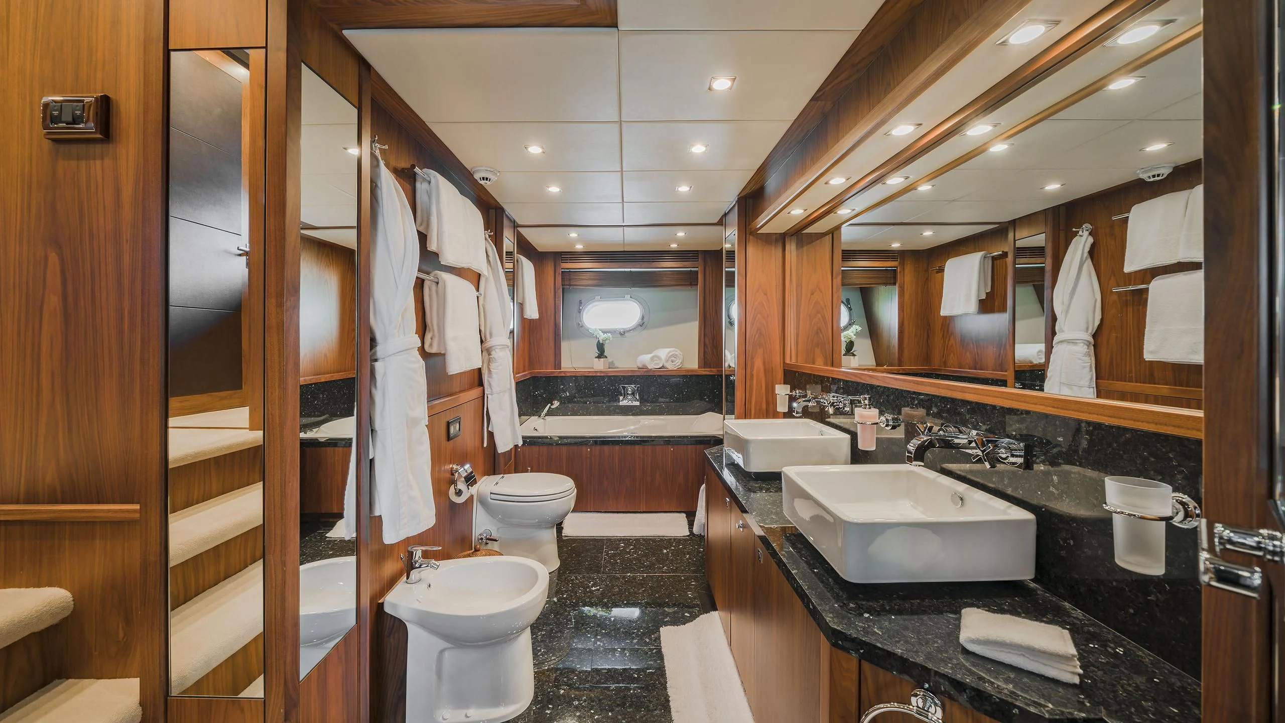 a bathroom with a large mirror aboard THE DEVOCEAN Yacht for Sale