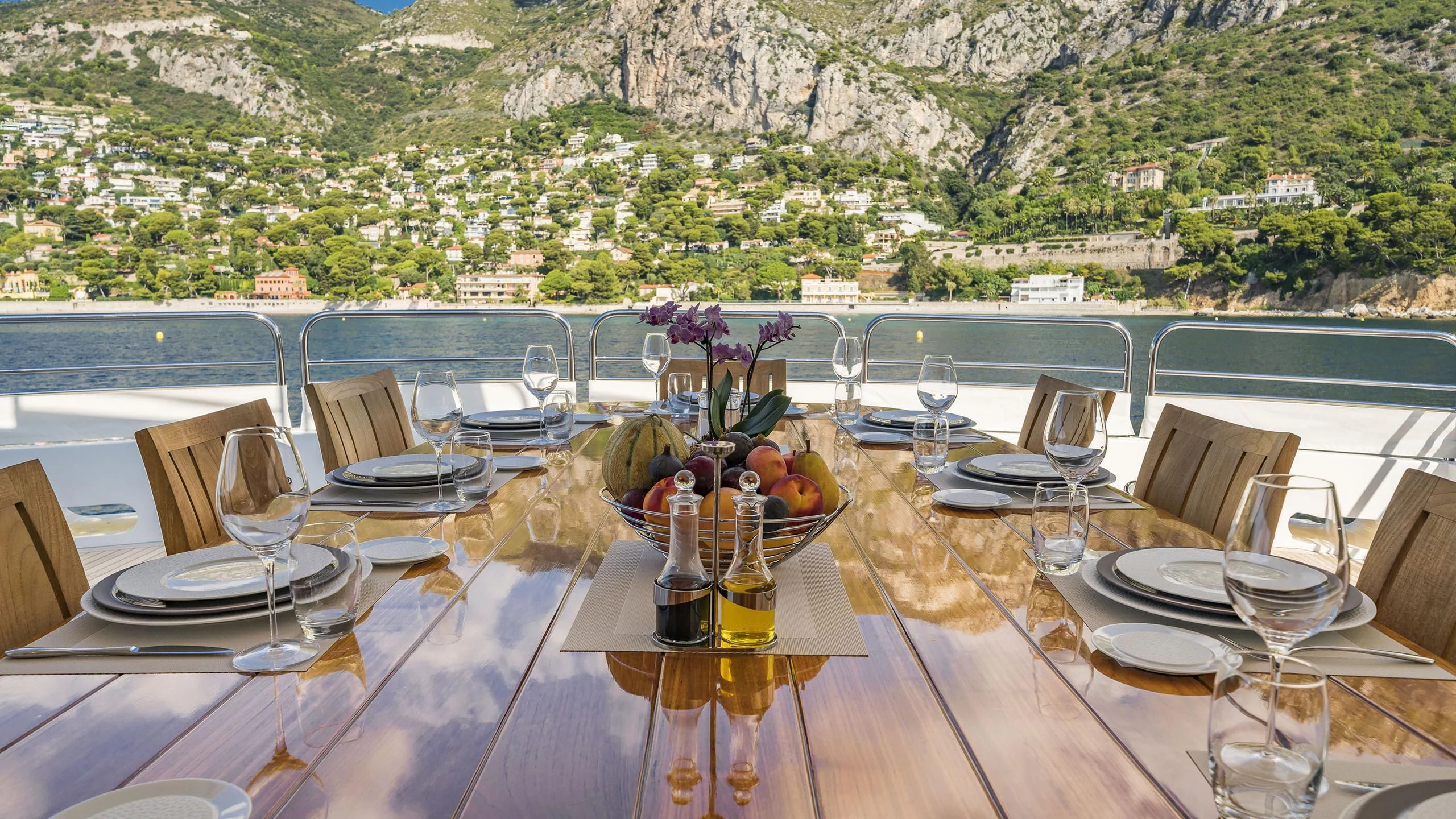 a table set for a dinner party aboard THE DEVOCEAN Yacht for Sale