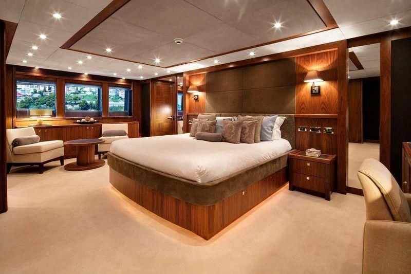 a large bed in a room aboard THE DEVOCEAN Yacht for Sale