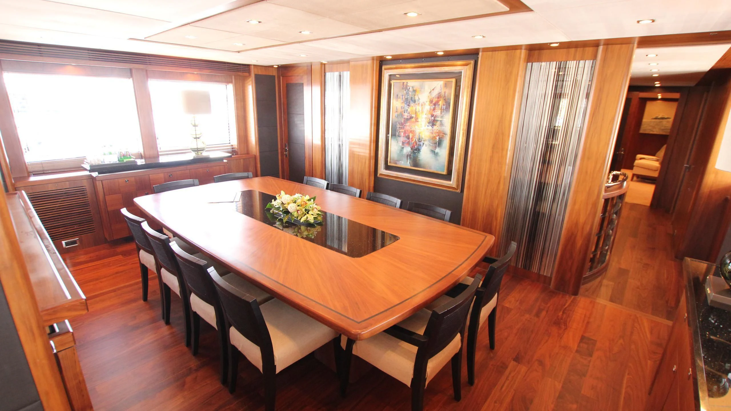 a dining table in a room aboard THE DEVOCEAN Yacht for Sale