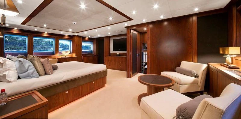 a large bedroom with a bed and a tv aboard THE DEVOCEAN Yacht for Sale
