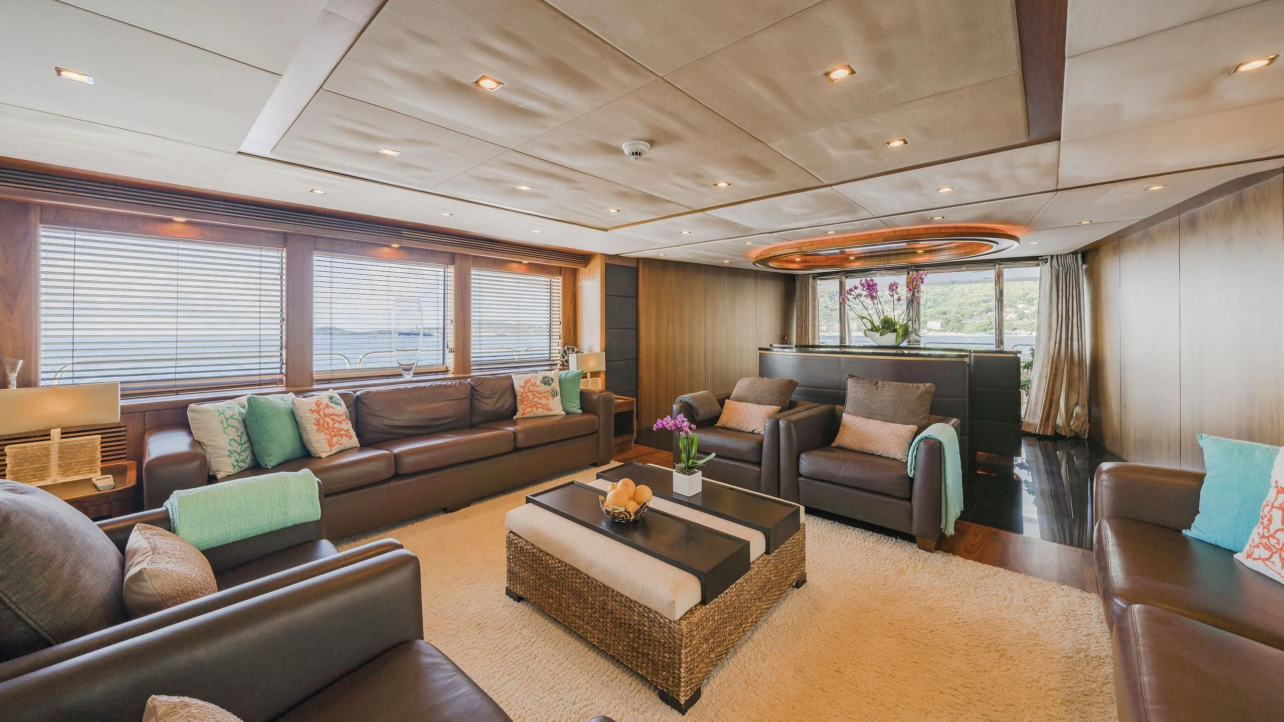 a living room with a couch and a coffee table aboard THE DEVOCEAN Yacht for Sale