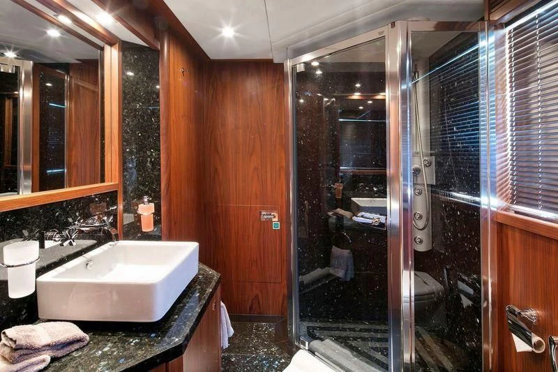 a bathroom with a large tub aboard THE DEVOCEAN Yacht for Sale
