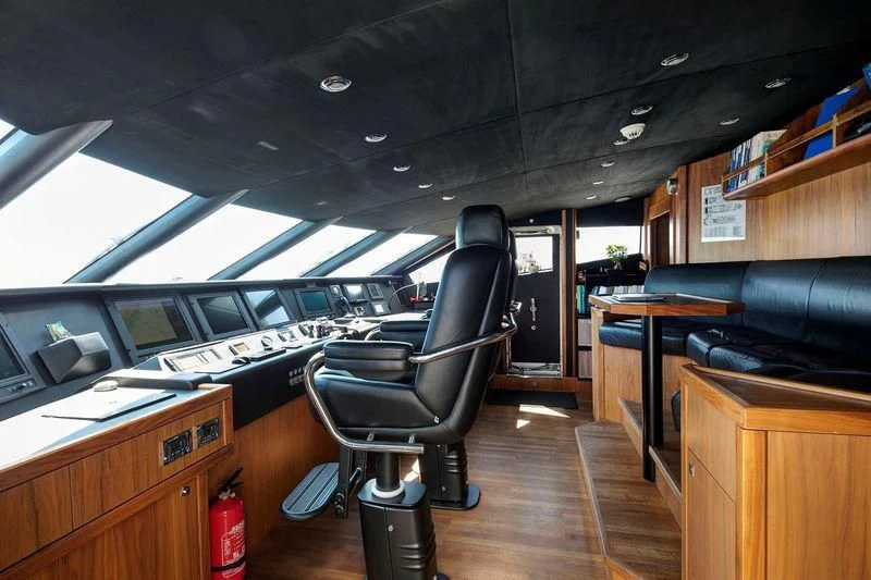 a room with a chair and a desk aboard THE DEVOCEAN Yacht for Sale