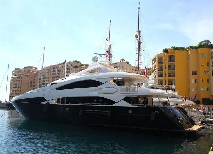 a boat docked in a harbor aboard THE DEVOCEAN Yacht for Sale