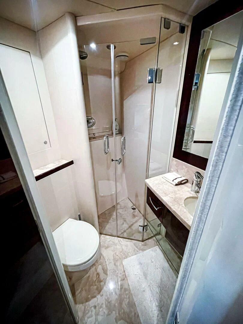 a bathroom with a shower and sink aboard LOVIN LIFE Yacht for Sale