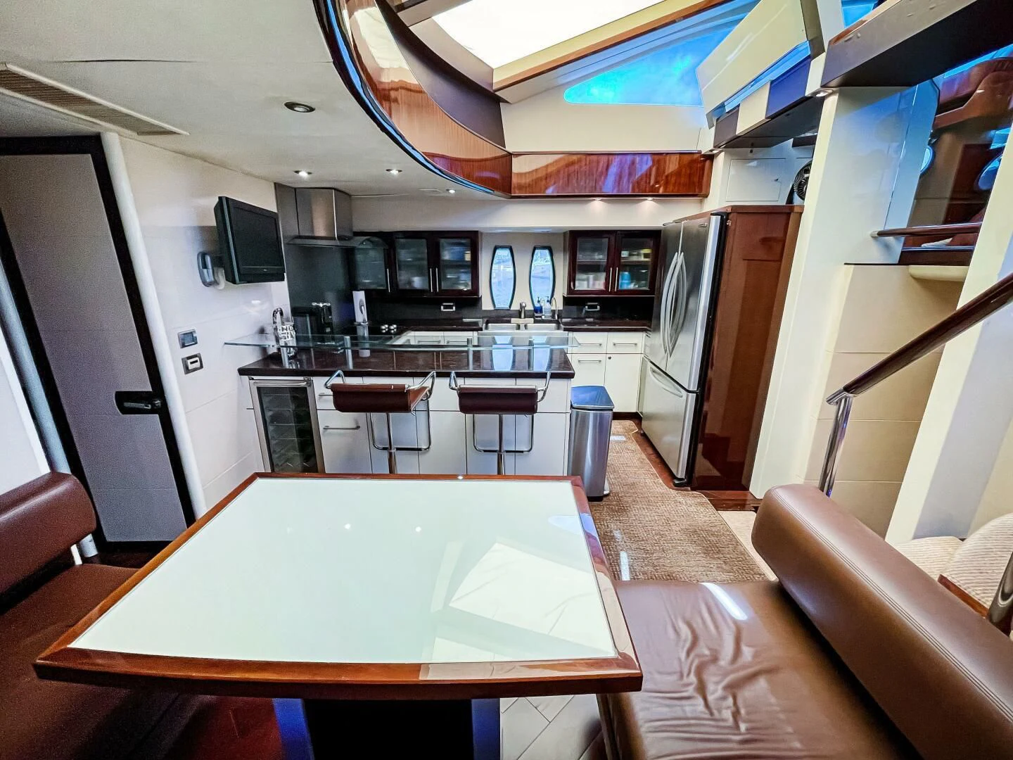 a kitchen with a table and chairs aboard LOVIN LIFE Yacht for Sale