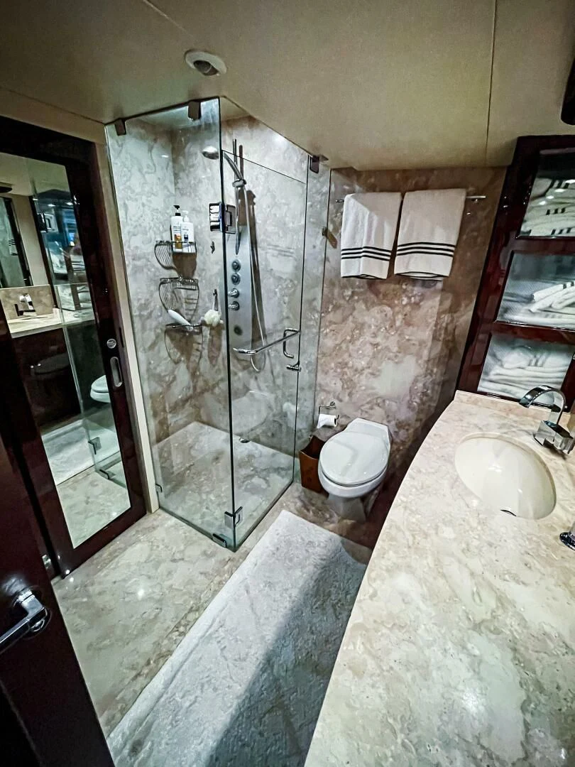 a bathroom with a glass shower aboard LOVIN LIFE Yacht for Sale