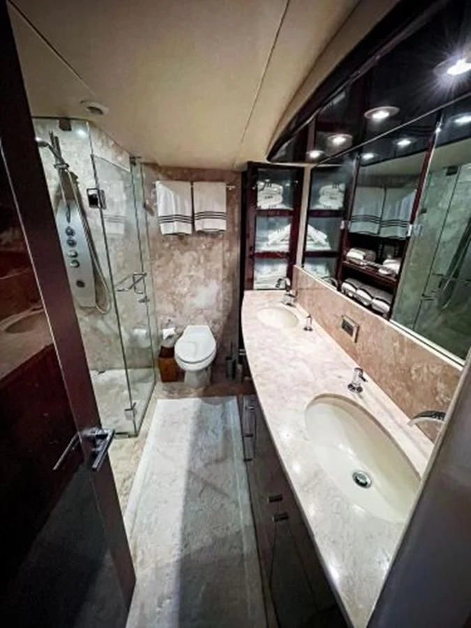 a bathroom with a sink and a mirror aboard LOVIN LIFE Yacht for Sale