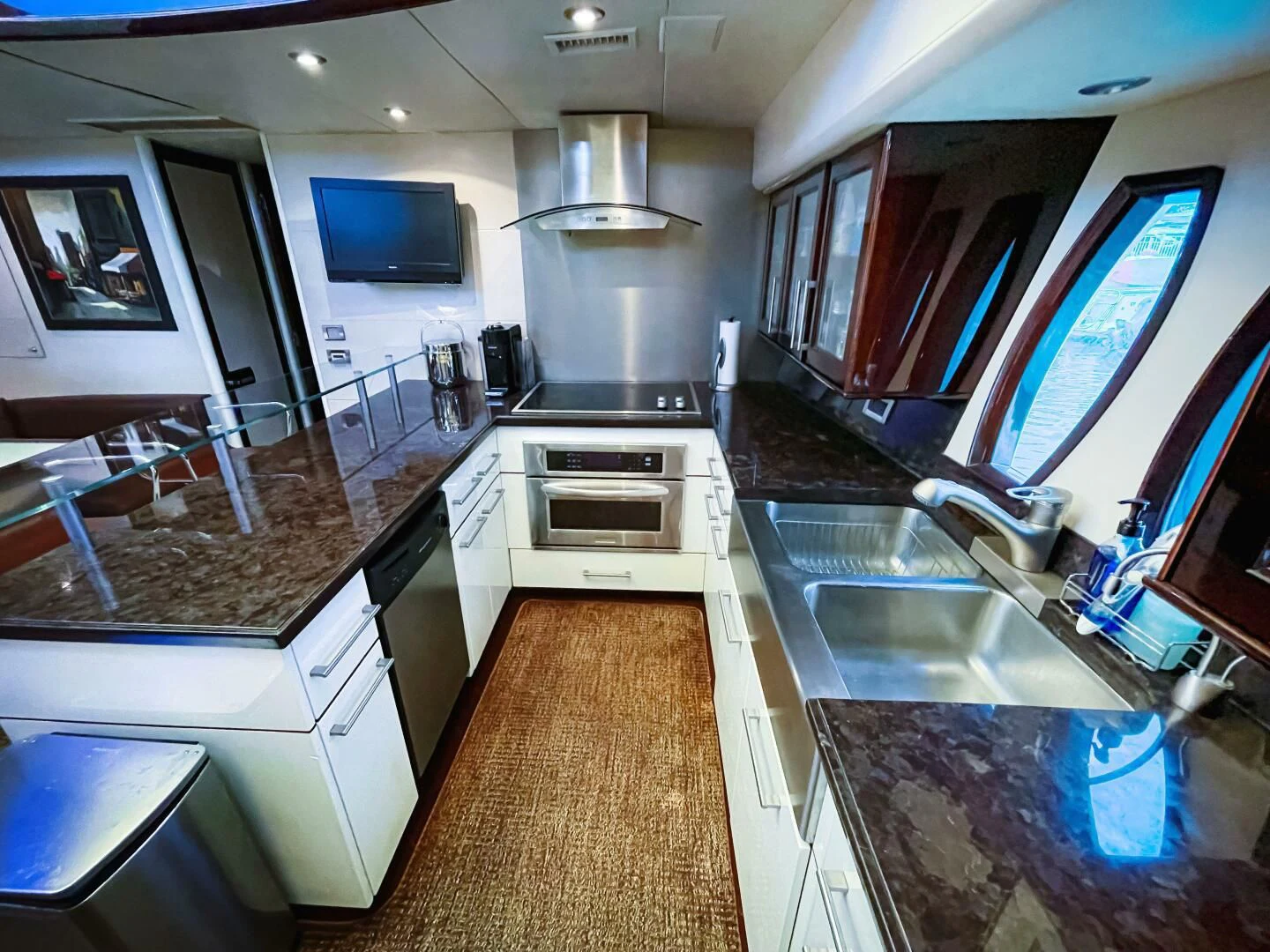 a kitchen with a large island aboard LOVIN LIFE Yacht for Sale