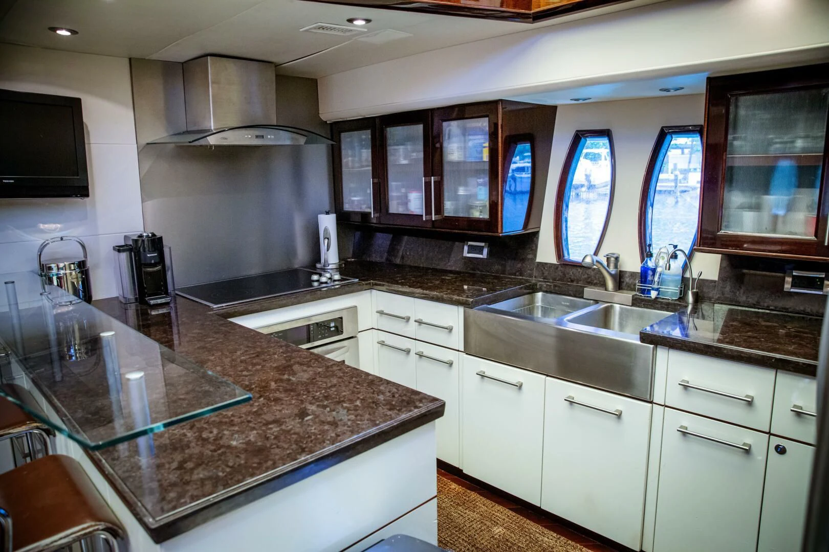 a kitchen with a marble counter top aboard LOVIN LIFE Yacht for Sale