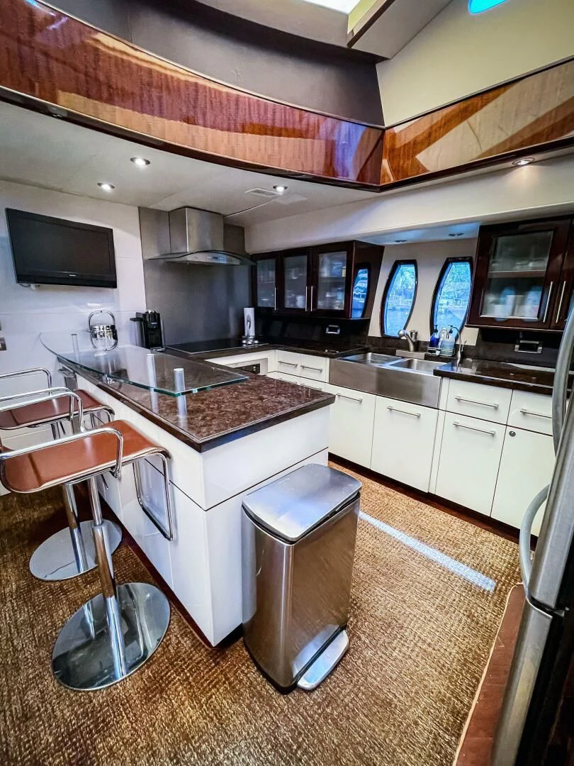 a kitchen with a bar and a bar aboard LOVIN LIFE Yacht for Sale