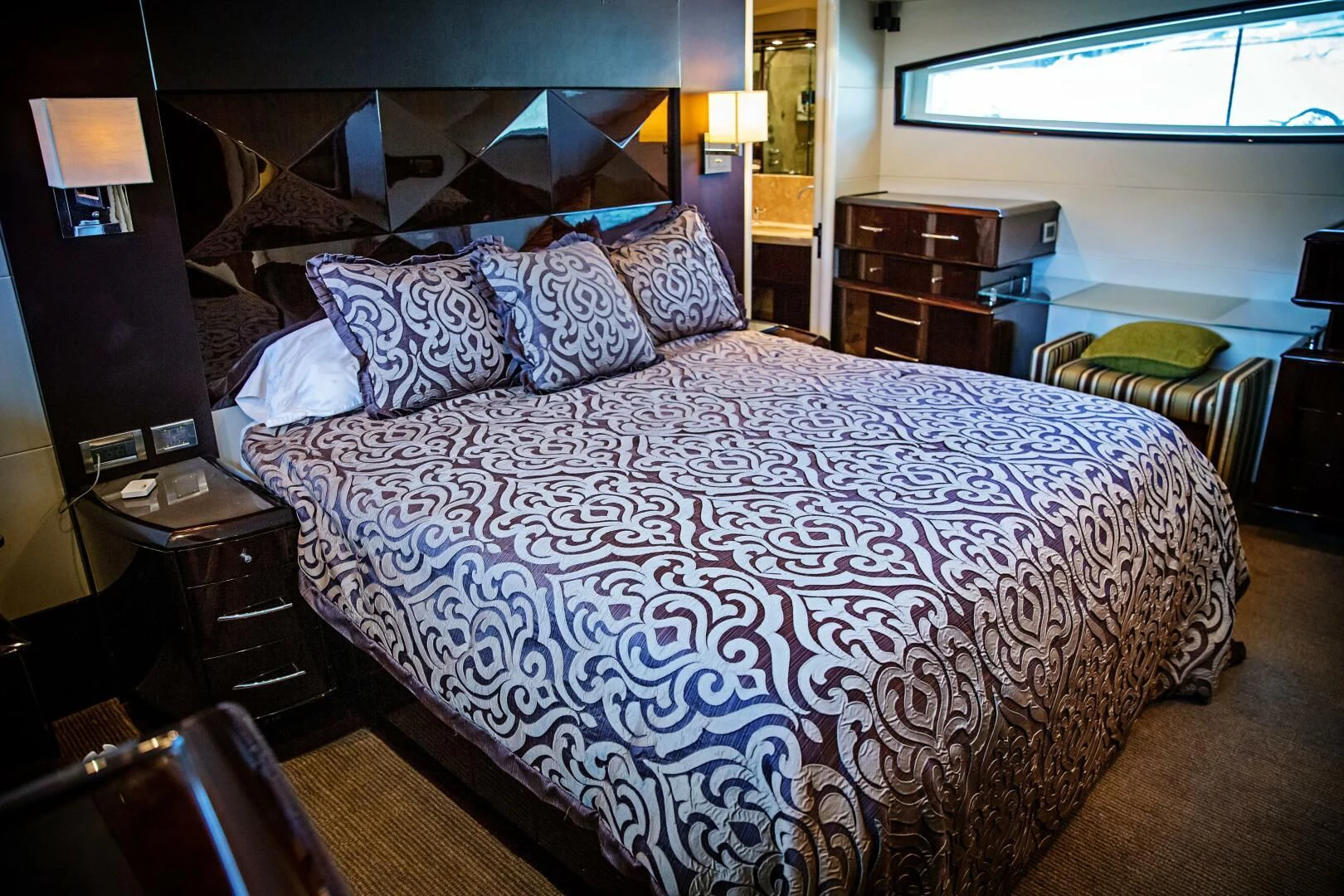 a bed with a blue comforter aboard LOVIN LIFE Yacht for Sale
