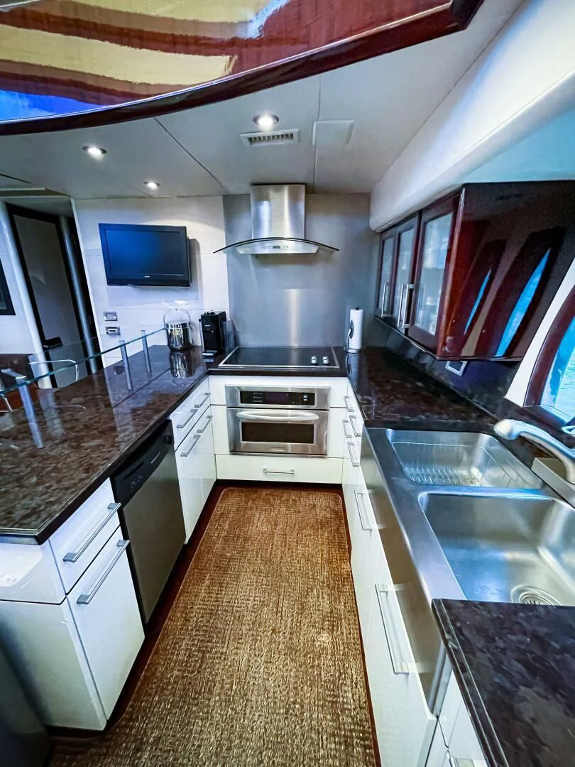 a kitchen with a large island aboard LOVIN LIFE Yacht for Sale