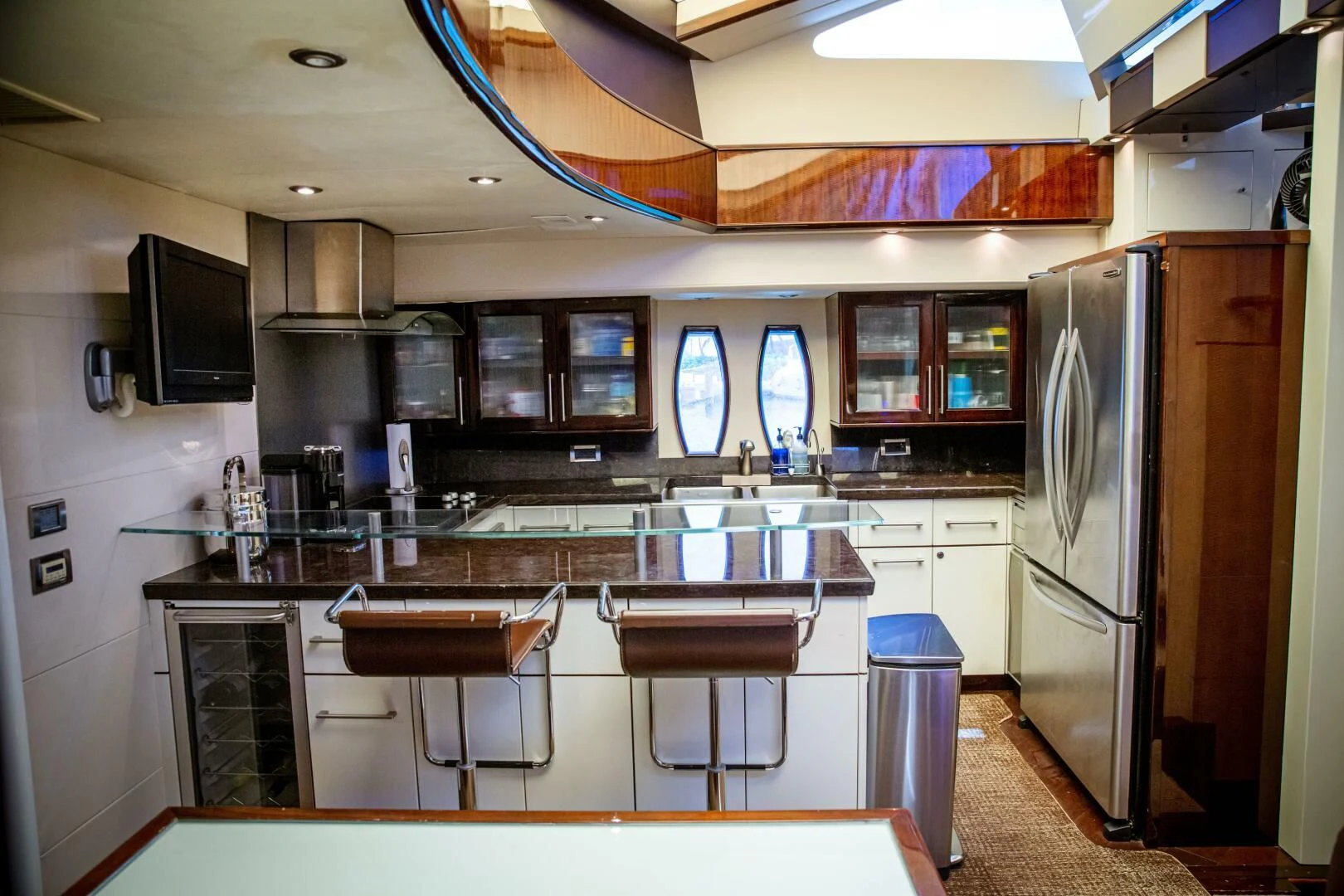 a kitchen with a fridge and microwave aboard LOVIN LIFE Yacht for Sale