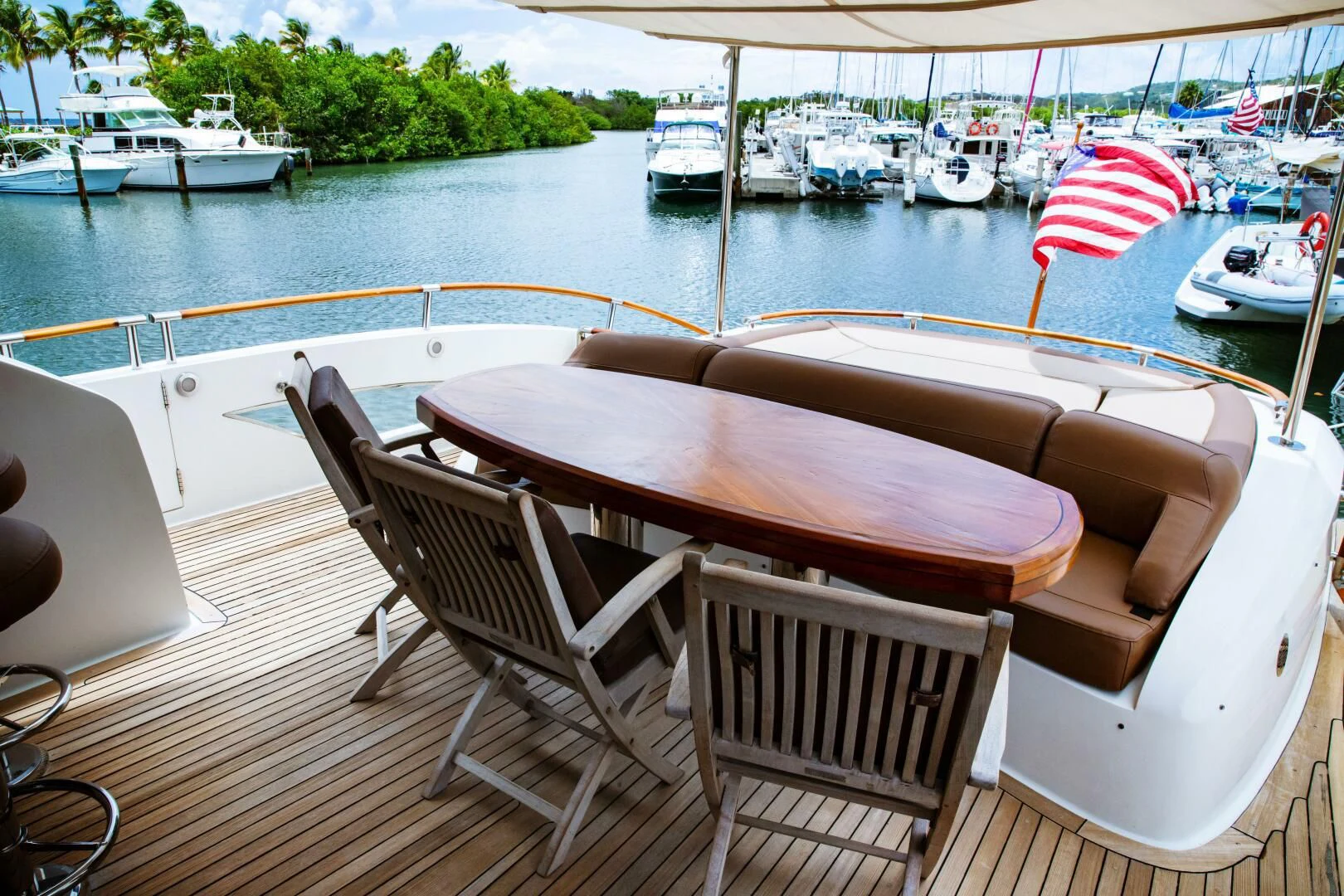 a table and chairs on a boat aboard LOVIN LIFE Yacht for Sale