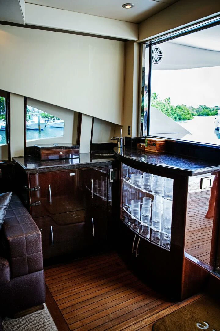 a kitchen with a bar and a window aboard LOVIN LIFE Yacht for Sale