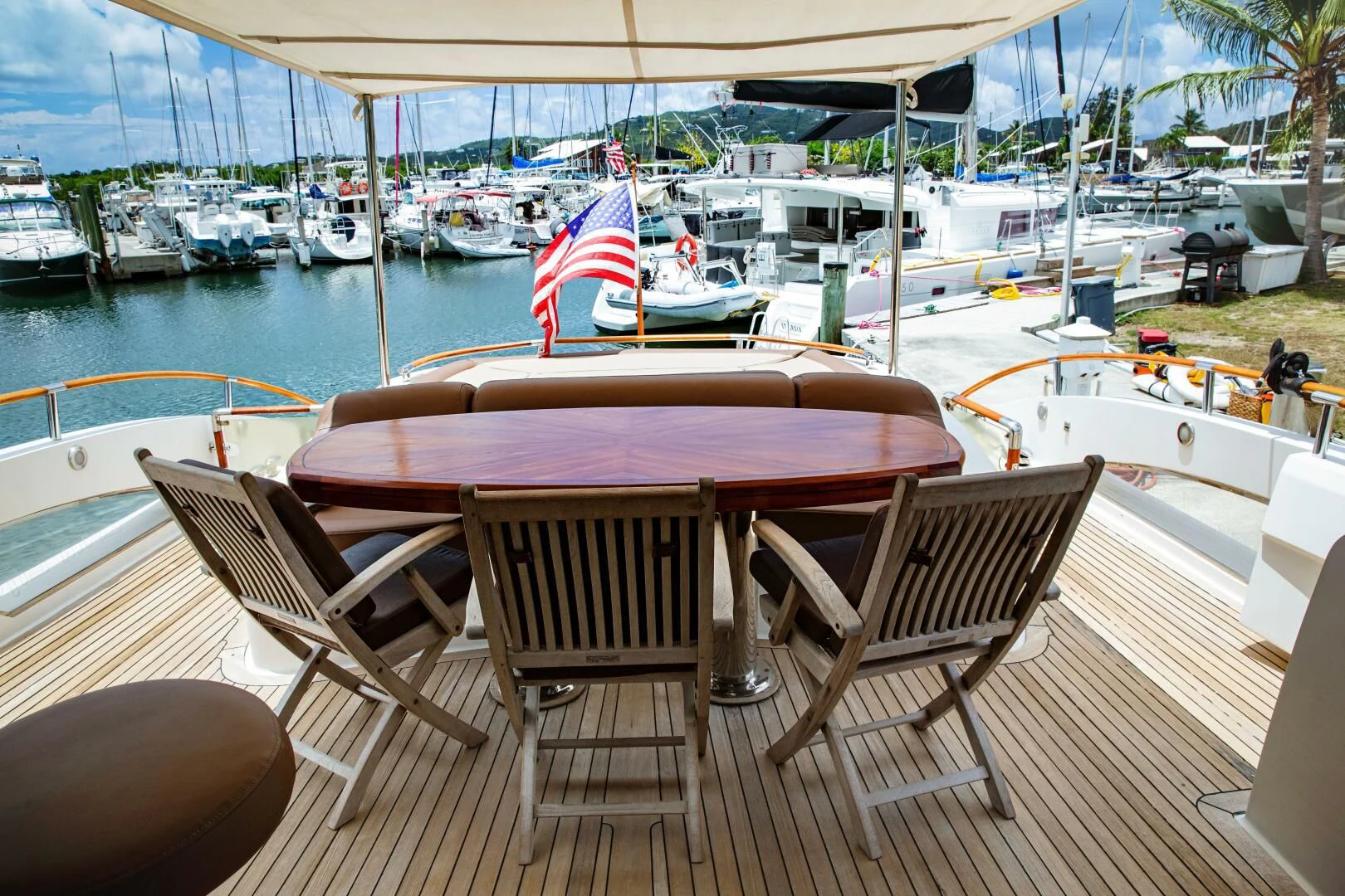 a table and chairs on a deck aboard LOVIN LIFE Yacht for Sale