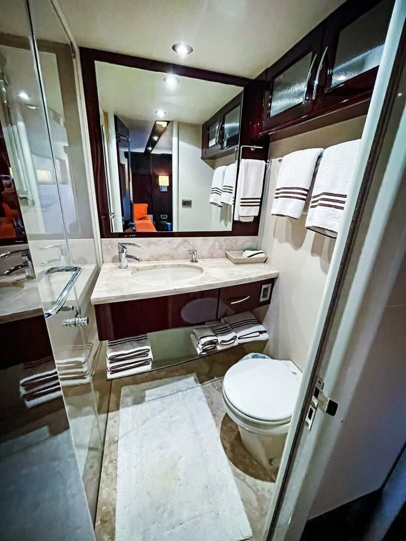 a bathroom with a large mirror aboard LOVIN LIFE Yacht for Sale