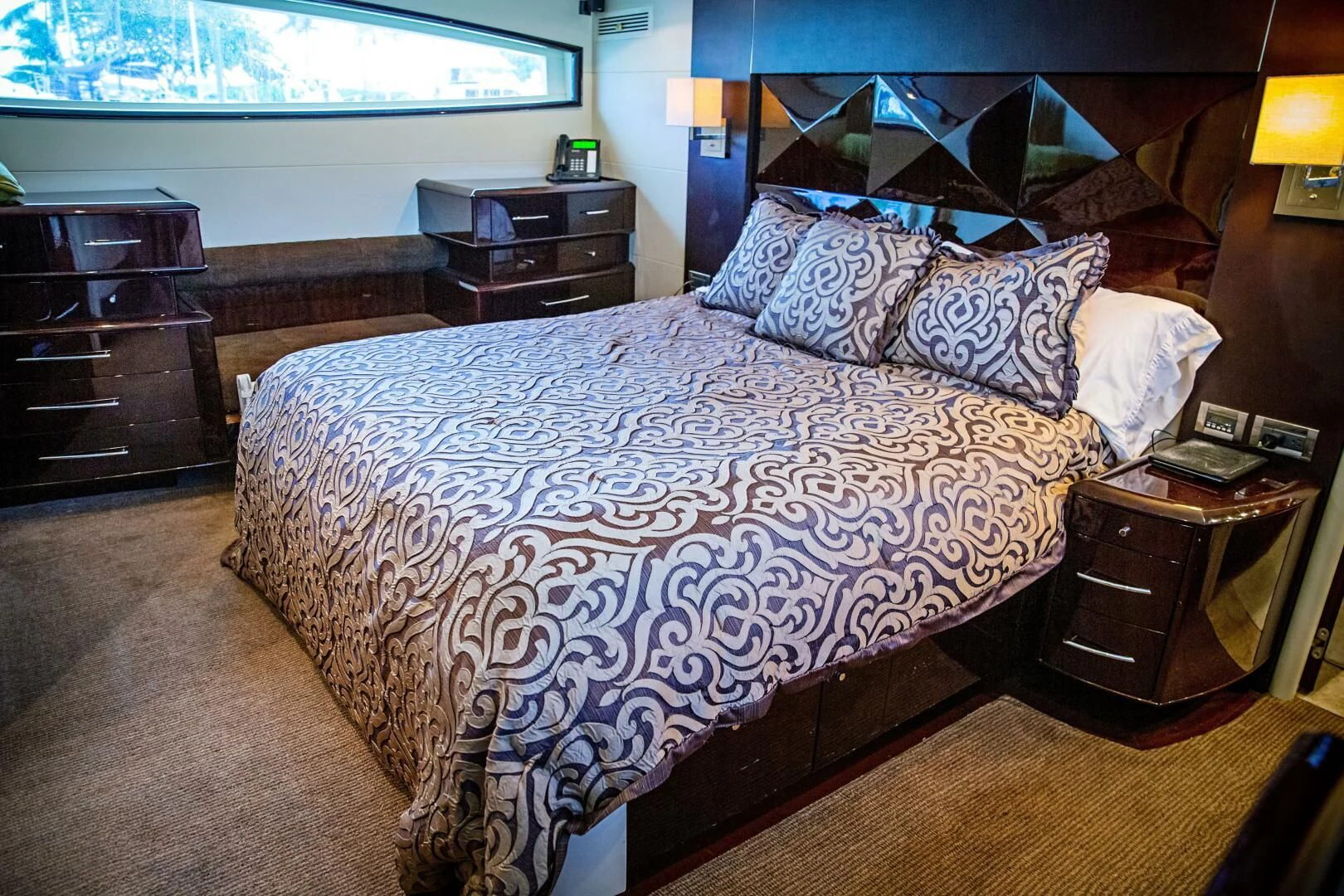 a bed with a blue comforter aboard LOVIN LIFE Yacht for Sale