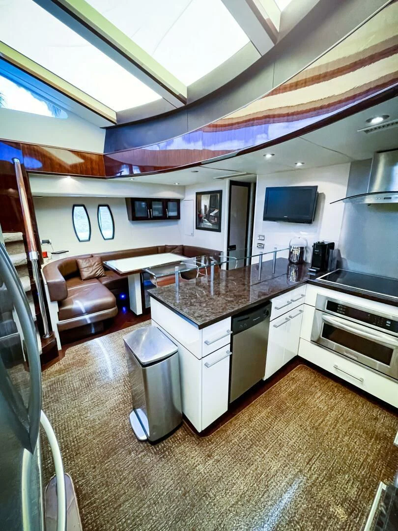 a kitchen with a large island aboard LOVIN LIFE Yacht for Sale