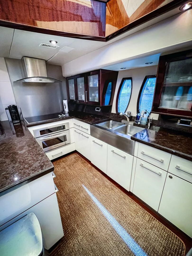 a kitchen with a large island aboard LOVIN LIFE Yacht for Sale