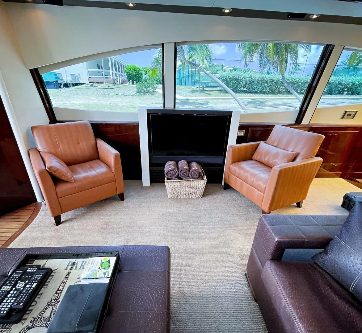 a living room with a tv and a couch aboard LOVIN LIFE Yacht for Sale