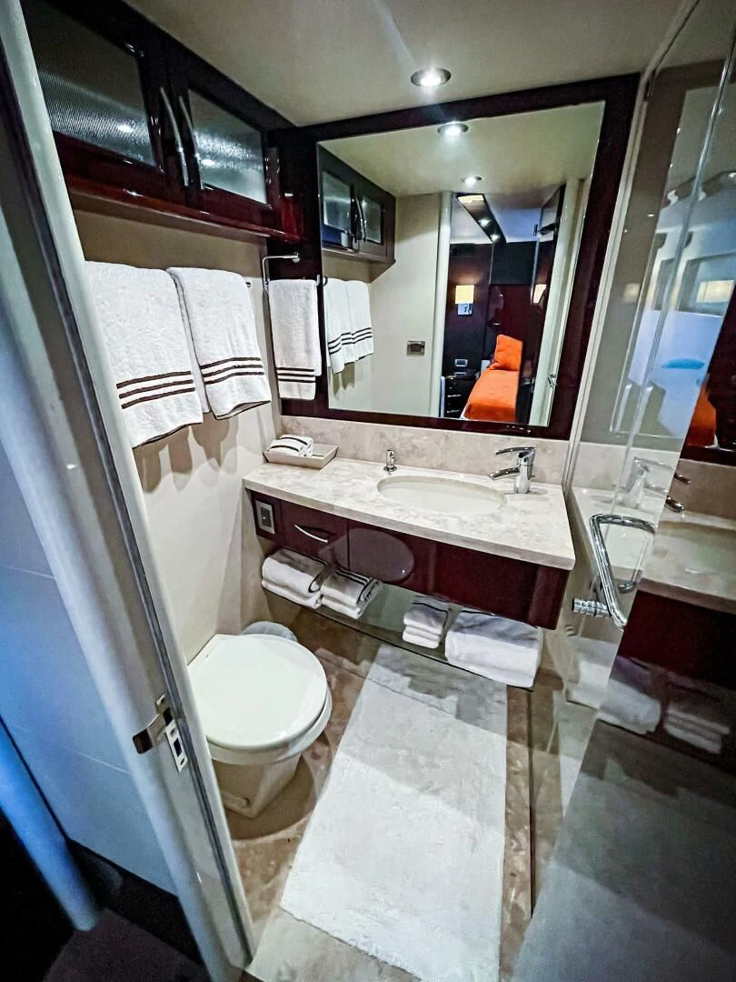 a bathroom with a large mirror aboard LOVIN LIFE Yacht for Sale