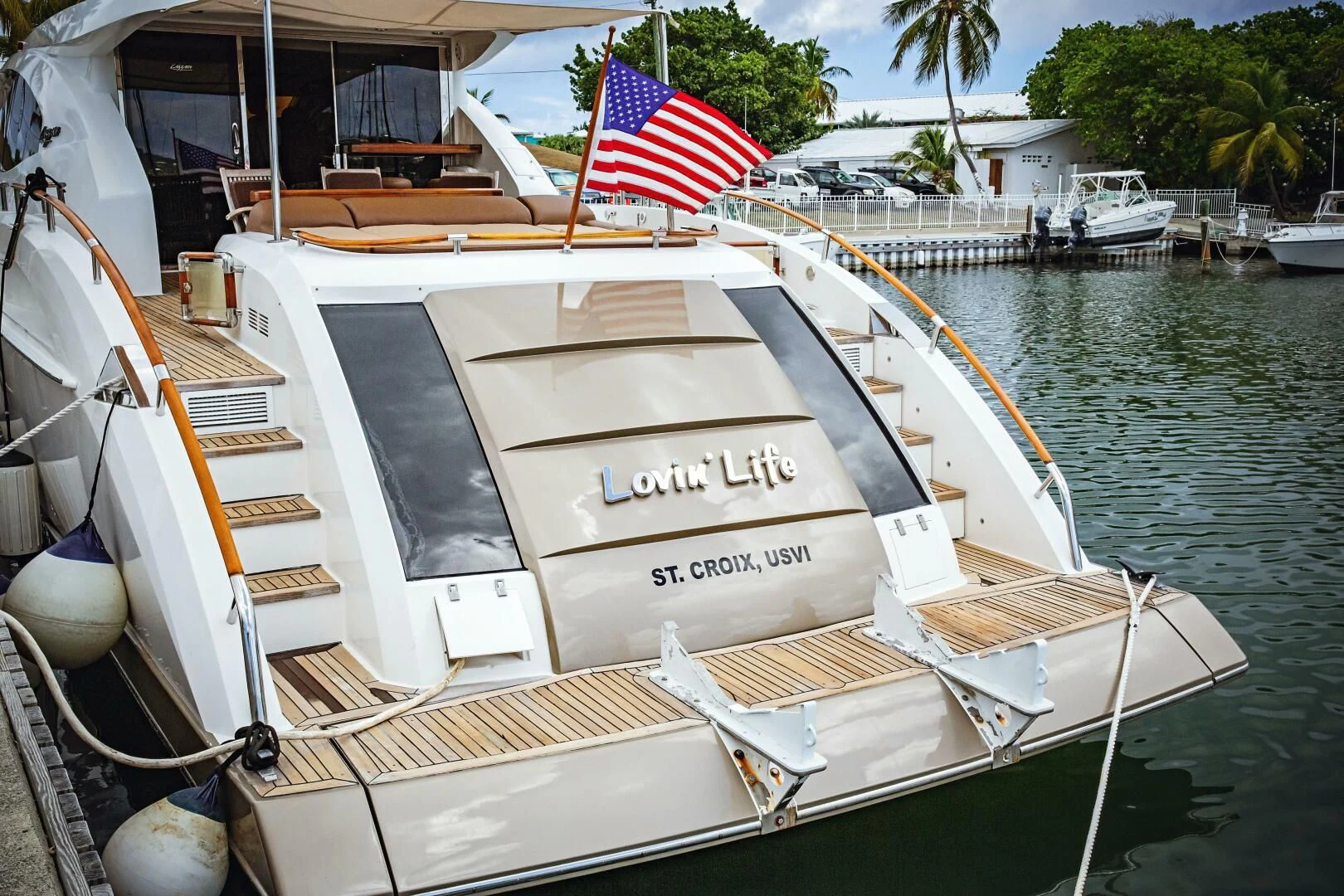 a boat with a flag on the front aboard LOVIN LIFE Yacht for Sale