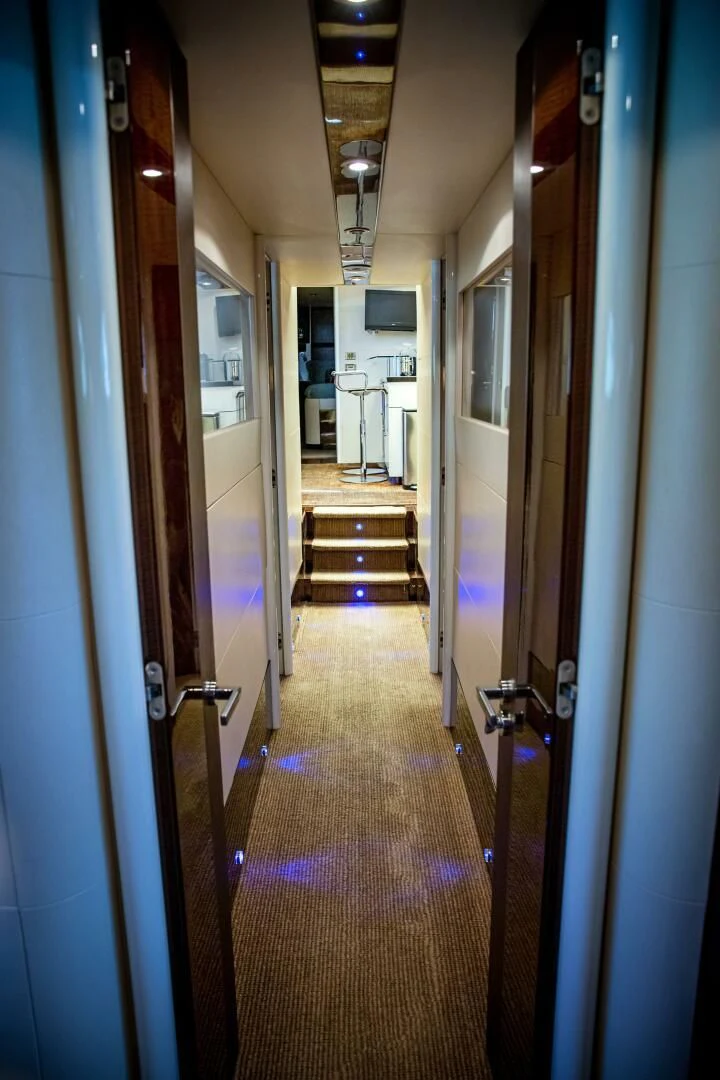 a hallway with a door and a hallway with doors aboard LOVIN LIFE Yacht for Sale