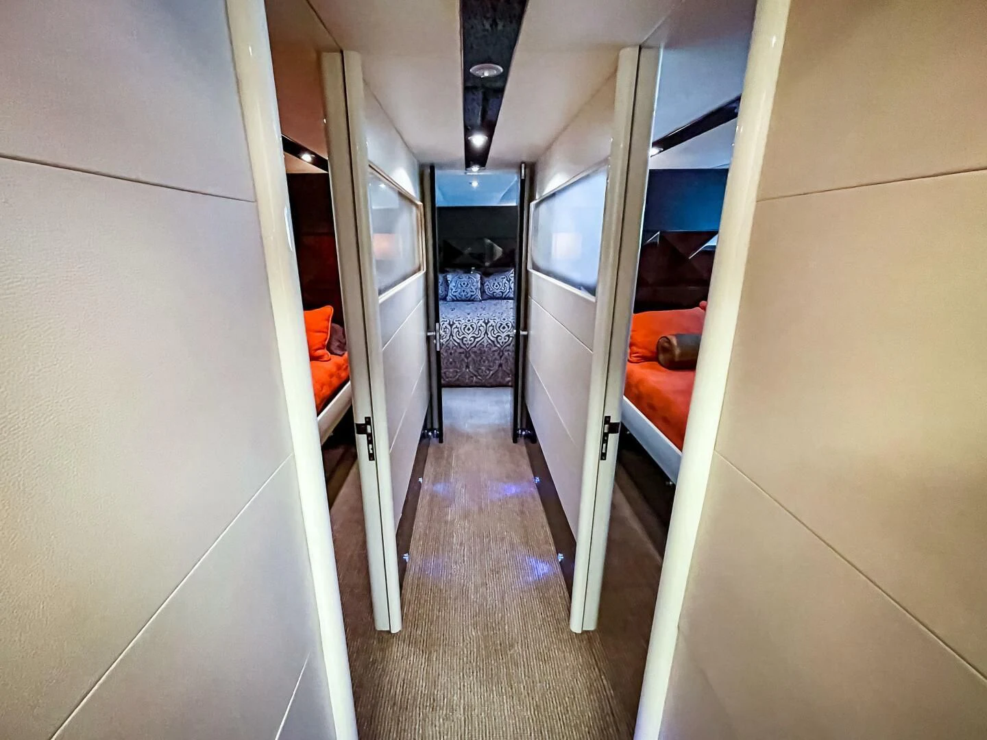 a hallway with a door and a bed aboard LOVIN LIFE Yacht for Sale