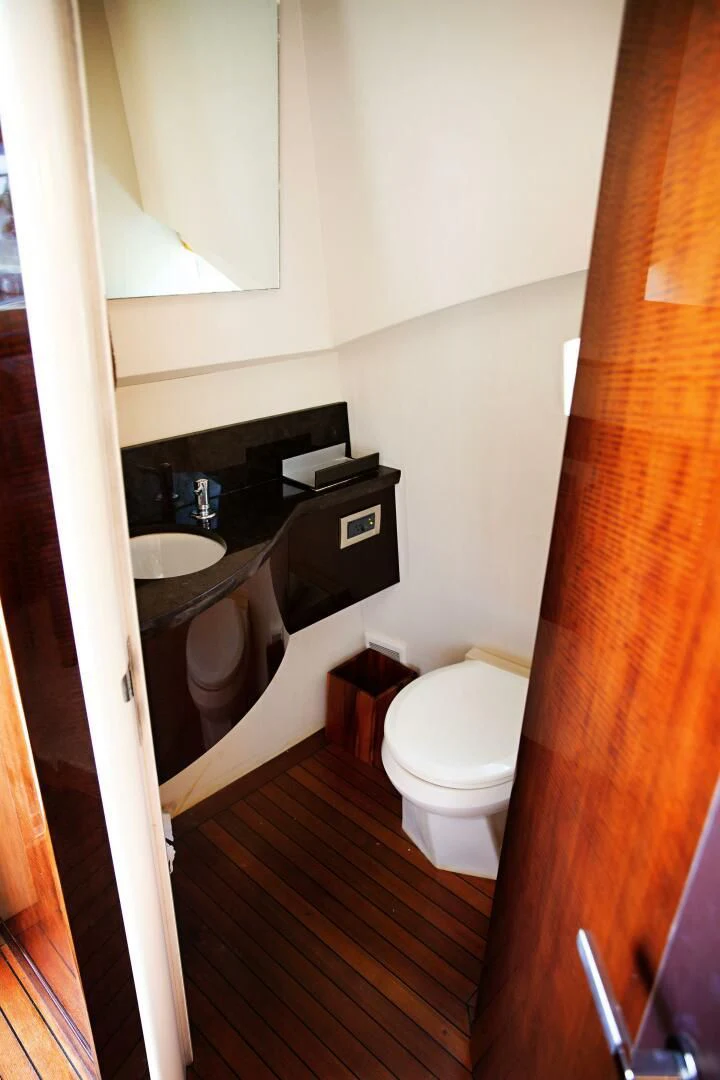 a bathroom with a sink and toilet aboard LOVIN LIFE Yacht for Sale
