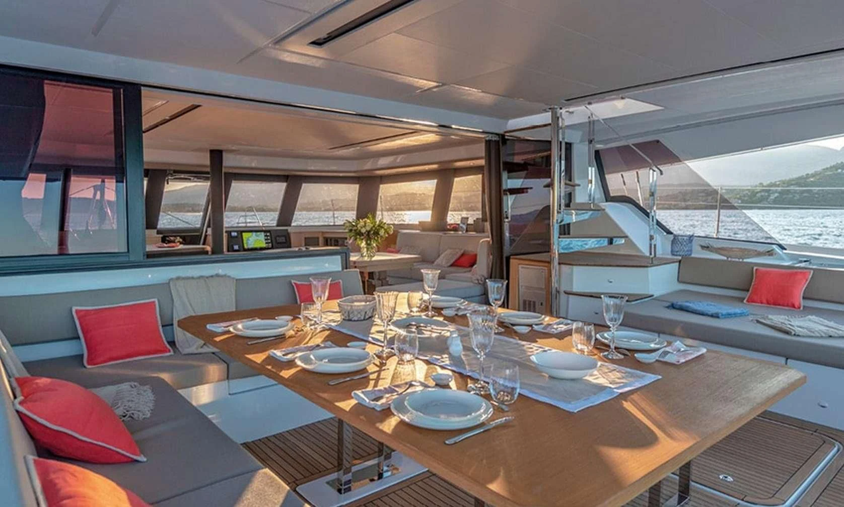 a table with plates and cups on it aboard LISA OF THE SEAS Yacht for Sale
