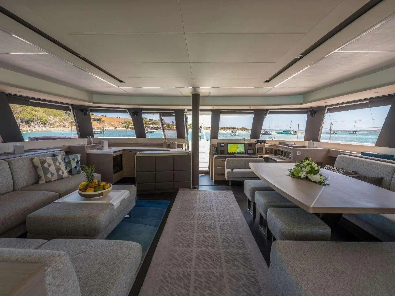 a room with a couch and a table aboard LISA OF THE SEAS Yacht for Sale