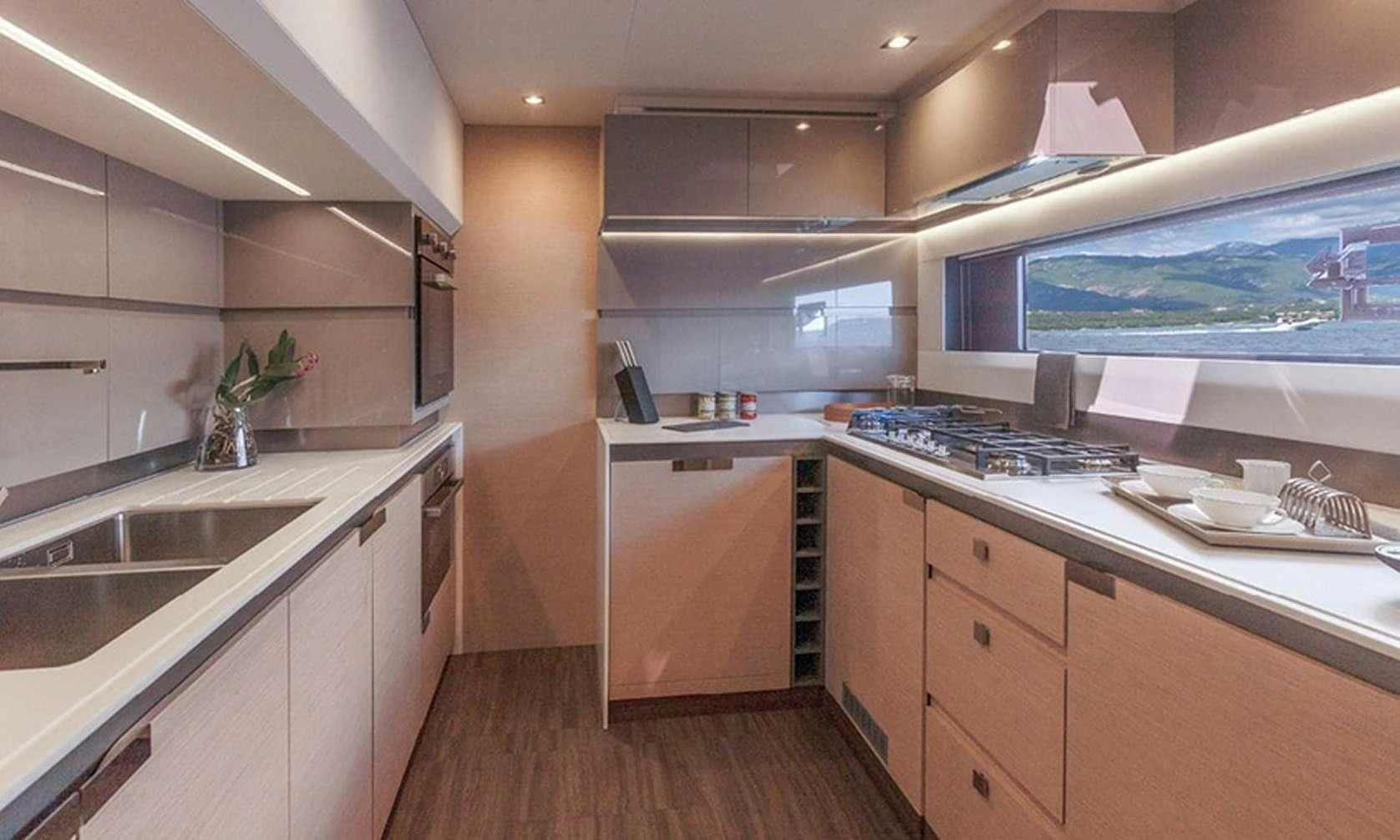a kitchen with a large window aboard LISA OF THE SEAS Yacht for Sale