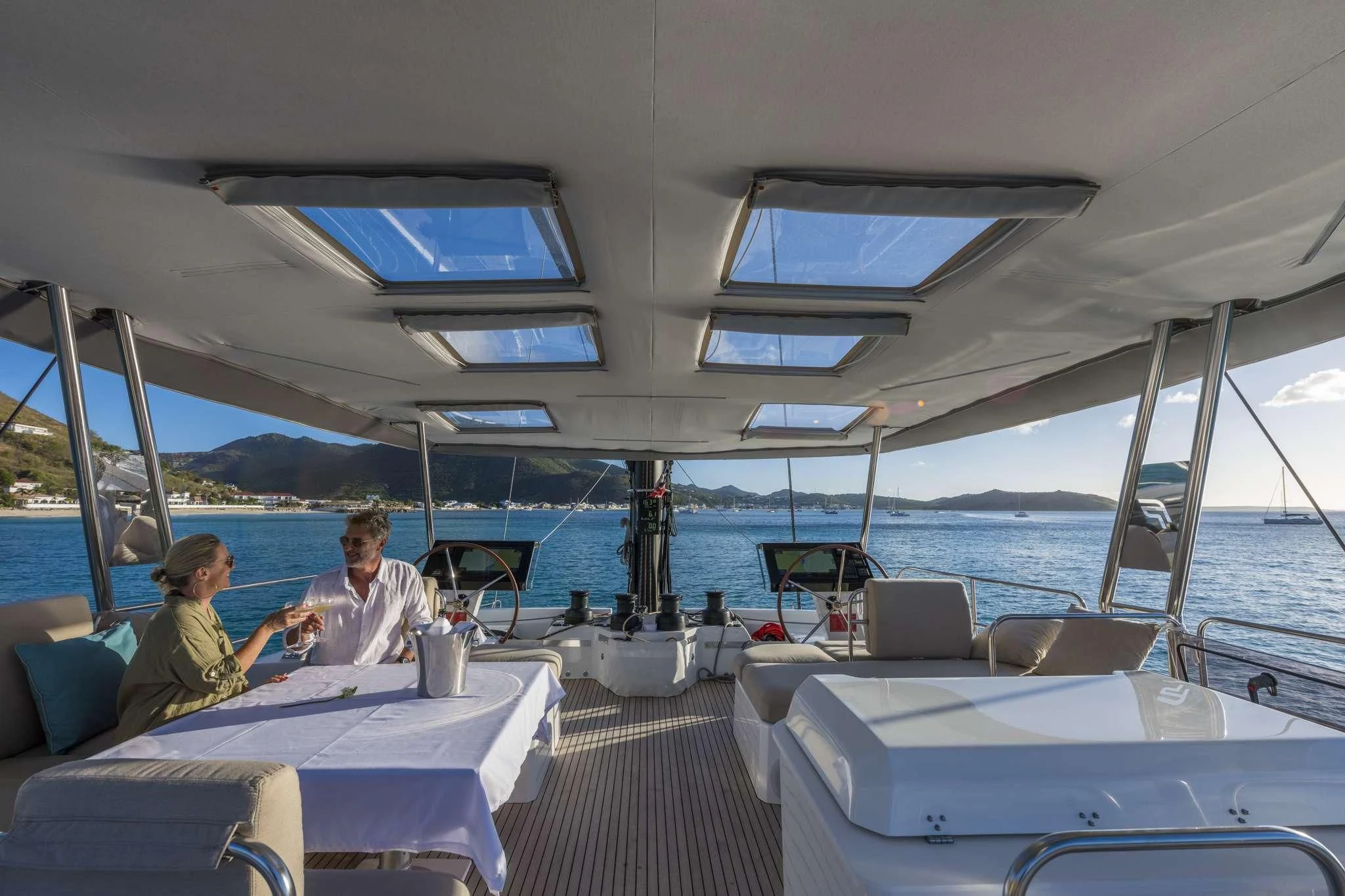 a group of people sitting on a boat aboard LISA OF THE SEAS Yacht for Sale