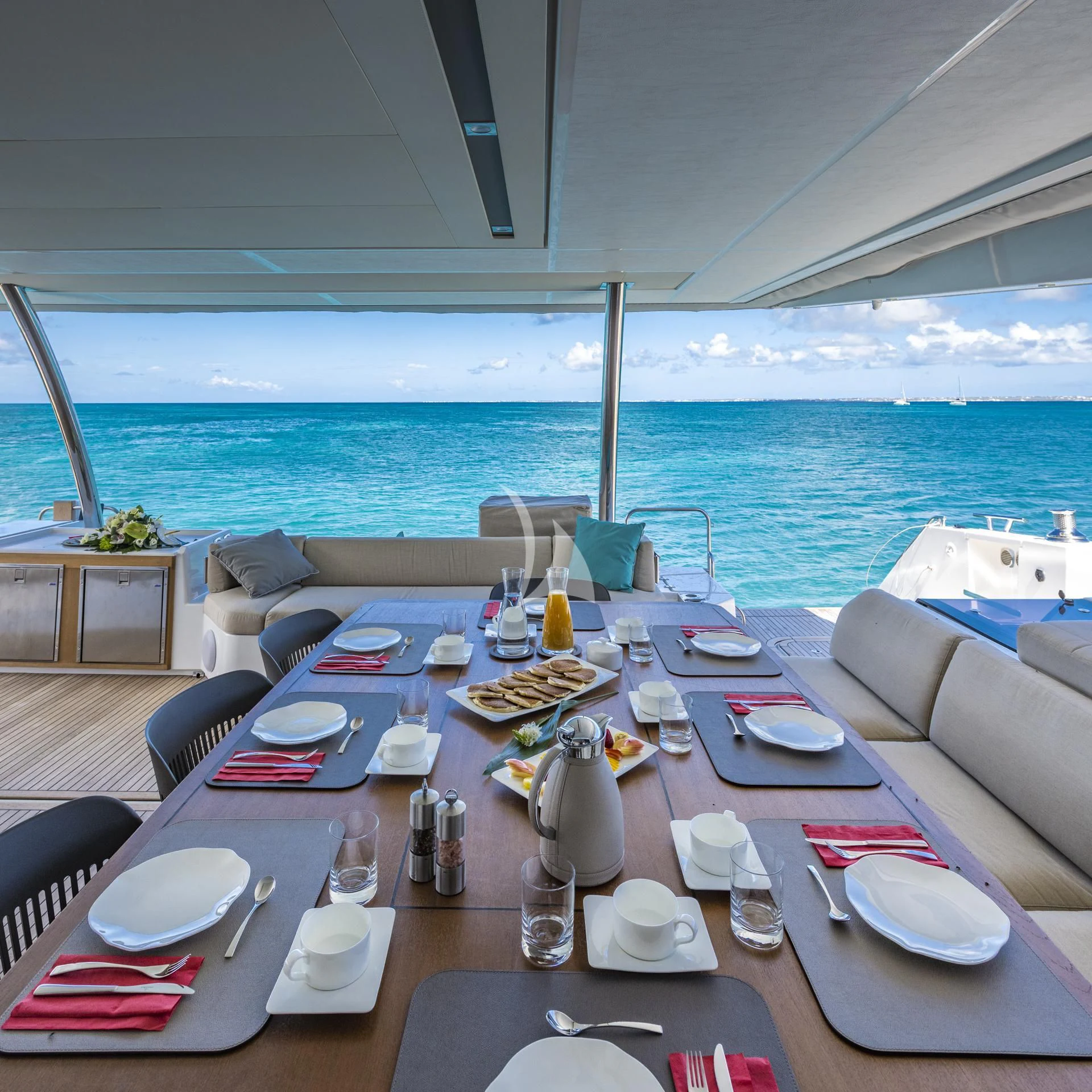 a table set for a dinner on a boat aboard LISA OF THE SEAS Yacht for Sale
