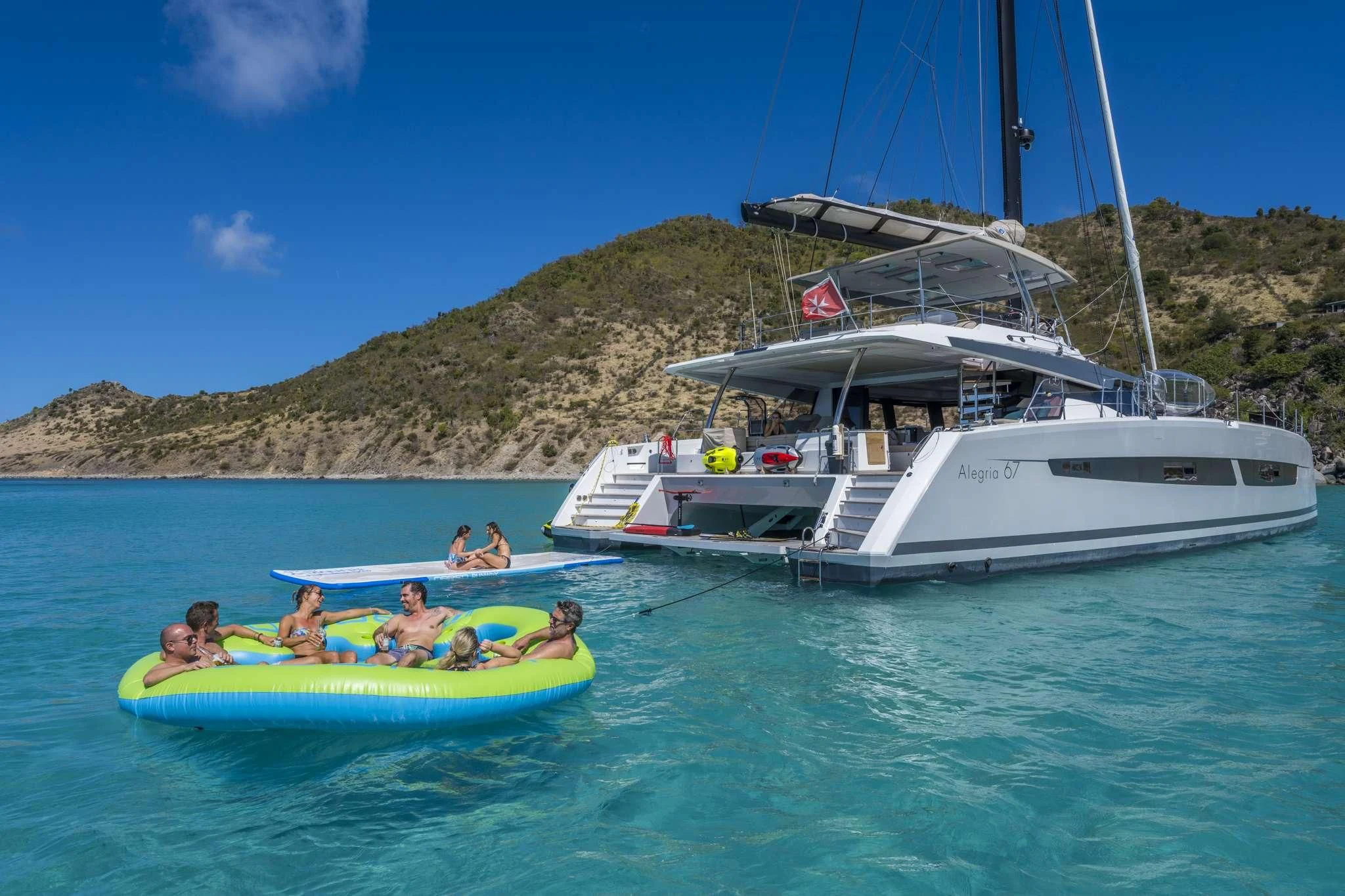 a group of people in a sailboat in the water aboard LISA OF THE SEAS Yacht for Sale