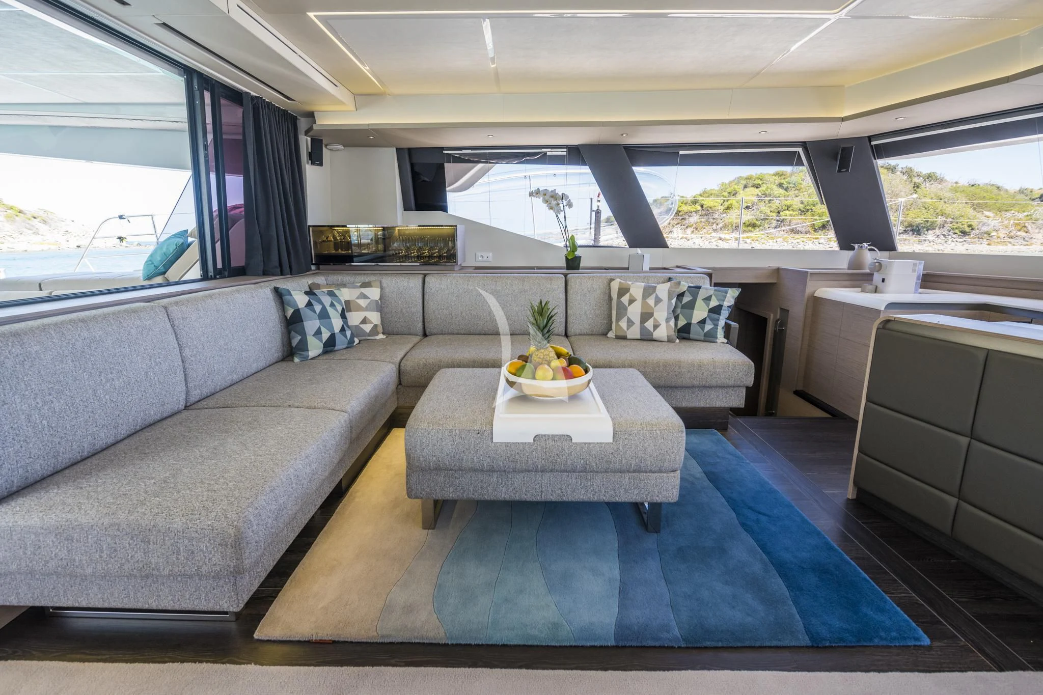 a living room with a couch and a table aboard LISA OF THE SEAS Yacht for Sale