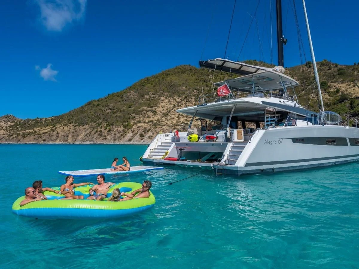 a group of people in a sailboat in the water aboard LISA OF THE SEAS Yacht for Sale