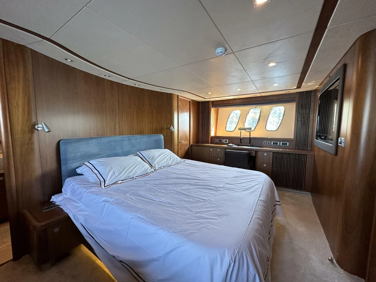 a room with a bed and a television aboard LOW PROFILE Yacht for Sale