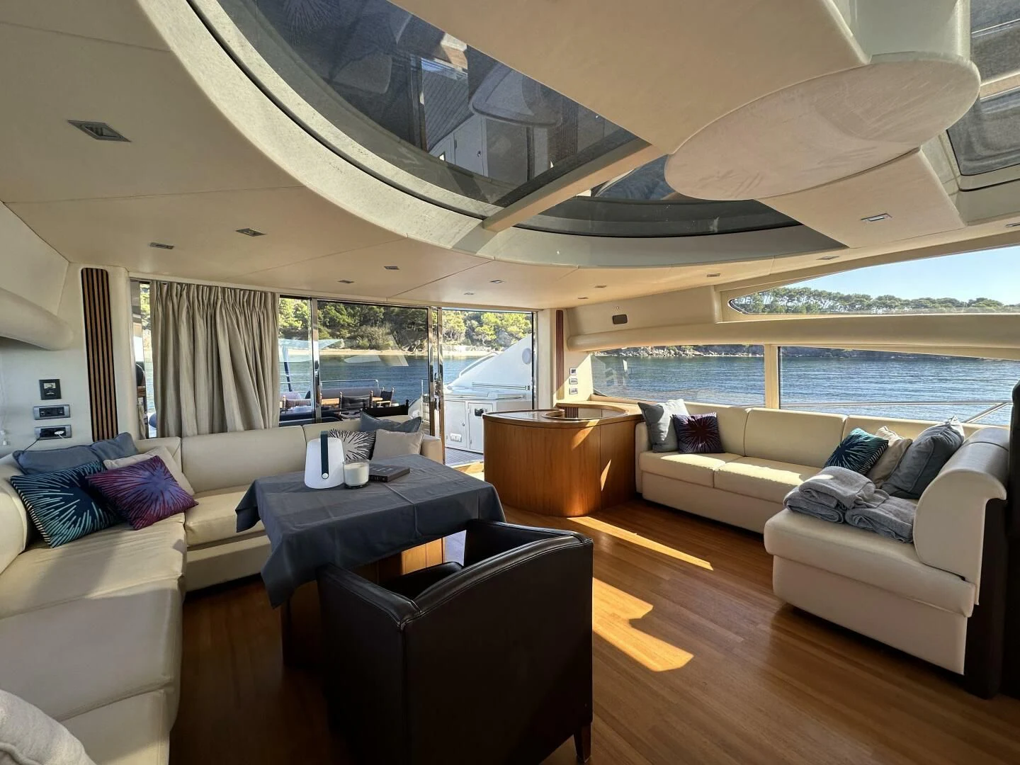 a living room with a large open window aboard LOW PROFILE Yacht for Sale