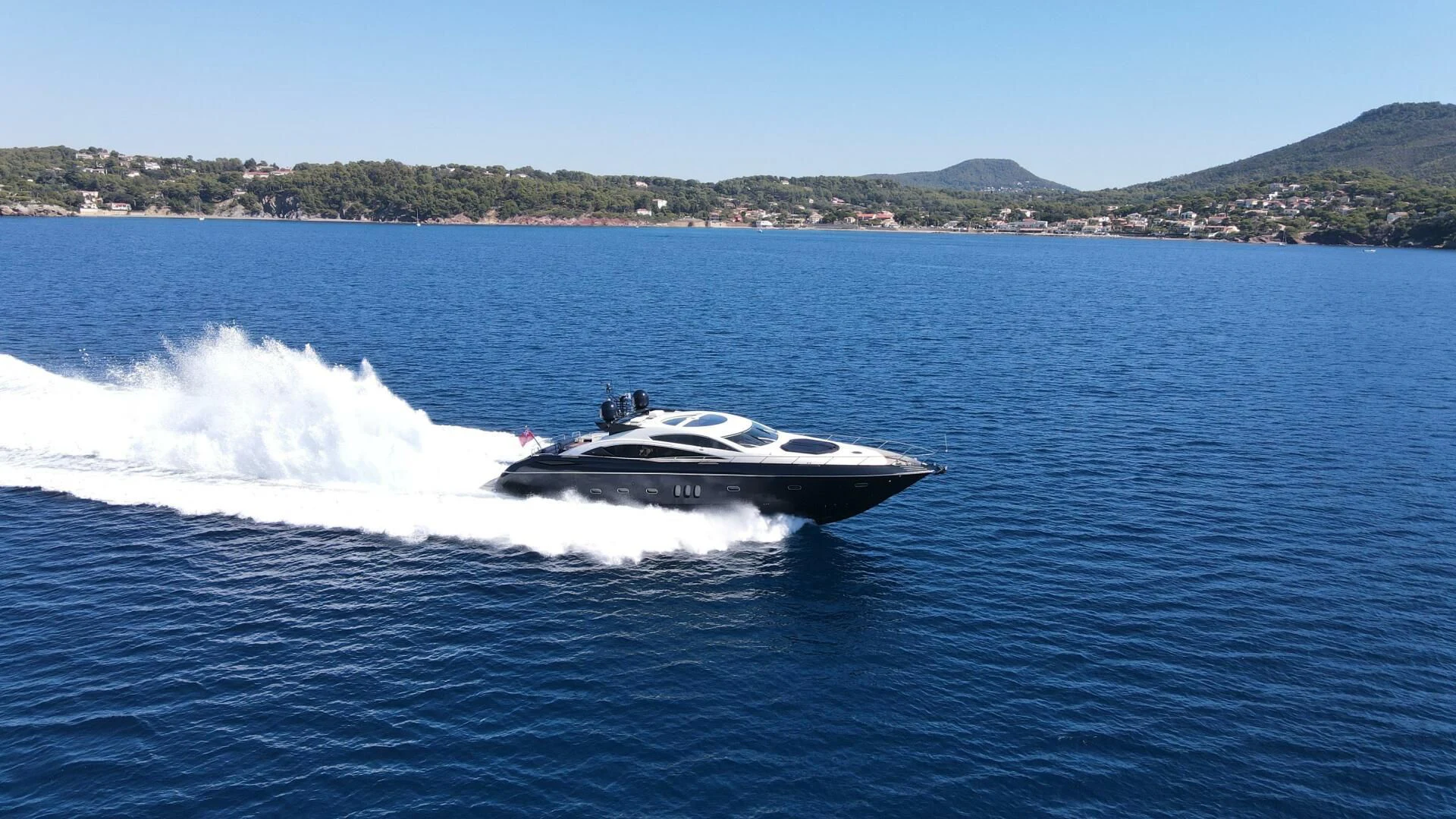 a boat on the water aboard LOW PROFILE Yacht for Sale
