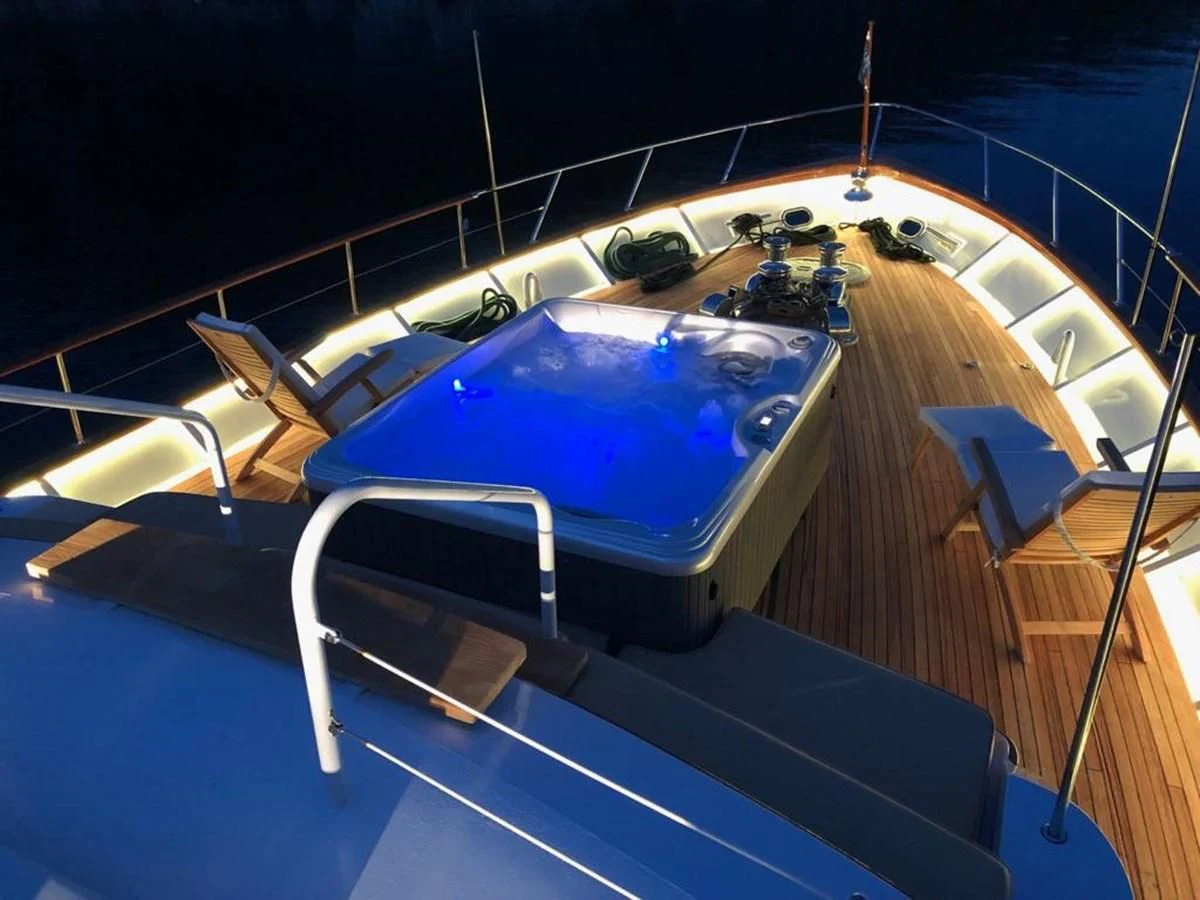 a pool with a table and chairs aboard ADRIATIC ESCAPE Yacht for Sale