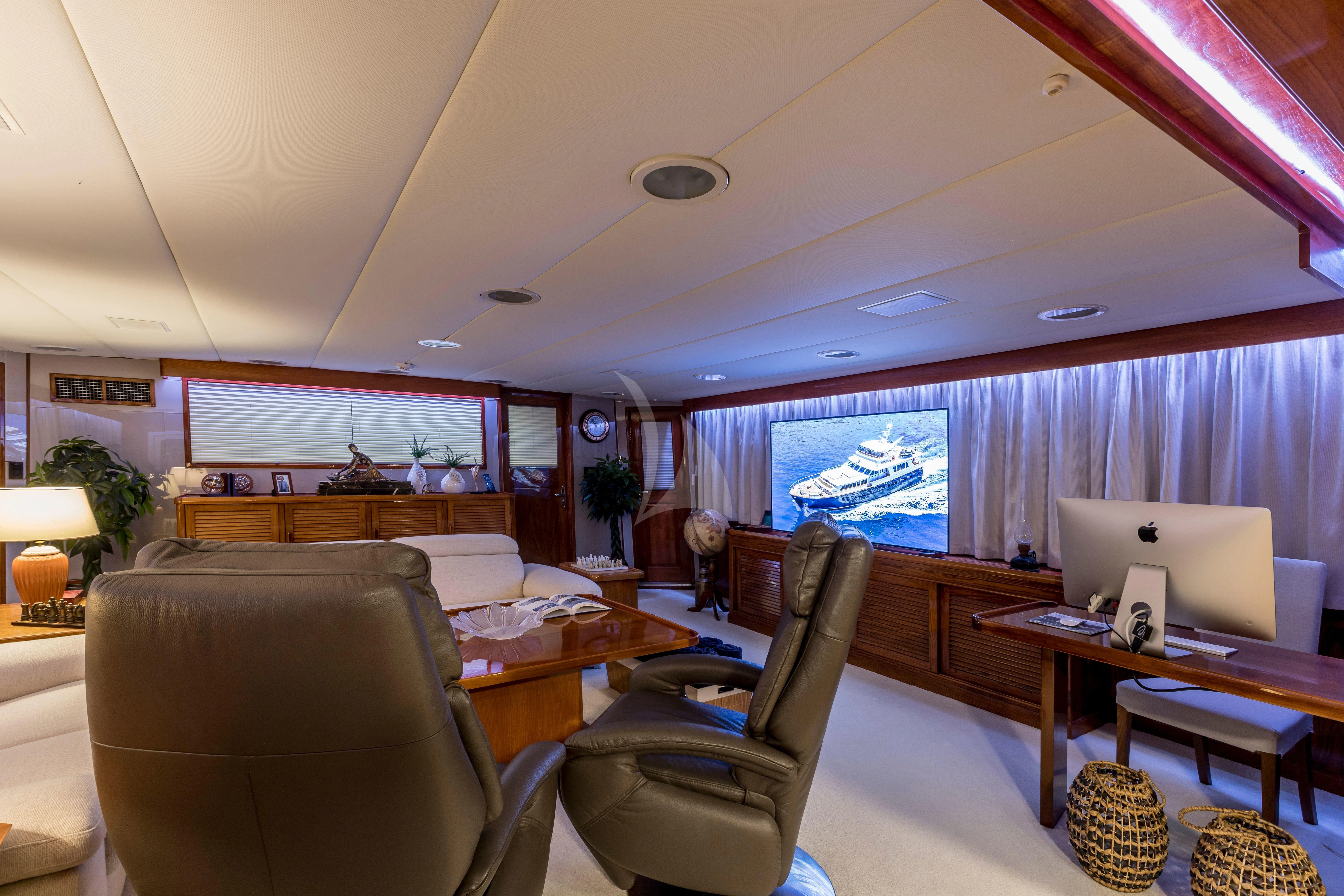 a living room with a laptop aboard ADRIATIC ESCAPE Yacht for Sale